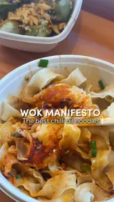 Here are a few options for your SEO alt text, keeping it under 125 characters:

**Option 1 (Descriptive & SEO focused):**
Bowl of spicy chilli oil noodles with garnishes from Wok Manifesto restaurant in Newcastle.

**Option 2 (Action-oriented):**
Close-up of delicious chilli oil noodles being served at Wok Manifesto on Ridley Place, Newcastle.

**Option 3 (Short & punchy):**
A steaming bowl of authentic Asian chilli oil noodles from Wok Manifesto, Newcastle.

**SEO Tip:** Including the location (Newcastle) and the specific dish (chilli oil noodles) is the best way to help your image rank in local search results!