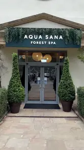 Here are a few options for your SEO alt text, all under 125 characters:

*   **Option 1 (Descriptive):** An outdoor hot tub and forest view at the Aqua Sana Spa in Center Parcs Sherwood Forest, Nottinghamshire.
*   **Option 2 (Action-oriented):** People relaxing in an outdoor pool surrounded by trees at Aqua Sana Spa in Sherwood Forest, Nottinghamshire.
*   **Option 3 (Concise):** Relaxing spa day with hot tubs and forest scenery at Aqua Sana Spa, Center Parcs Sherwood Forest. 

**SEO Tip:** I recommend **Option 1** as it includes the specific location and the name of the venue, which helps with local search visibility.