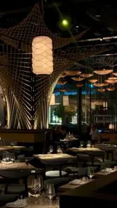 A montage video showcasing the interior, live music, cocktails, and Italian cuisine at Azzurra restaurant in Chelsea. The video features shots of oysters, steak, pasta, and desserts, alongside scenes of a live jazz performance, highlighting the venue's upscale and intimate atmosphere.