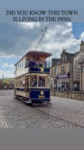 A montage showcasing the Beamish Museum, an open-air museum in County Durham, England, that recreates life in the 1900s. The video features vintage trams, buses, period-dressed staff, and historical shop interiors.