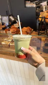 Here are a few options for your alt text, depending on the specific focus of the photo:

**Option 1 (Descriptive & SEO-focused):**
"A delicious matcha latte and fresh strawberry pastry served at The Bonnie Barista cafe in Edinburgh."

**Option 2 (Action-oriented):**
"Close-up of a vibrant green matcha drink and strawberry treats at The Bonnie Barista bakery in Edinburgh."

**Option 3 (Concise):**
"Matcha latte and strawberry pastries on a table at The Bonnie Barista coffee shop in Edinburgh."

**SEO Tip:** I included "Edinburgh" and "The Bonnie Barista" as these are high-value keywords for local discovery!