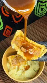 A short, punchy food-focused reel showcasing various grilled meat dishes, including brisket fries, lamb chops, and a burger, at Nyama Choma. The video highlights the food preparation and the final plated dishes, with a brief glimpse of the venue's interior and exterior.
