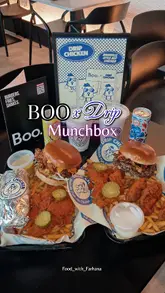 Here are a few options for your SEO alt text, depending on the focus of the image:

**Option 1 (Focus on the meal combo):**
Boo Burger and Drip Chicken Munchbox meal with Nashville hot chicken, smash burger, fries, and dipping sauces.

**Option 2 (Focus on the collaboration/brand):**
The Boo x Drip Chicken Munchbox featuring a jumbo Nashville hot chicken tender and a smash burger at the Batley Plaza.

**Option 3 (Descriptive & punchy):**
Delicious Boo x Drip Chicken Munchbox combo with spicy Nashville chicken, gourmet burger, fries, and signature drip sauce.

**SEO Tip:** If the image shows a specific location, keep "Boo x Drip Chicken" and "Munchbox" as your primary keywords, as those are what people searching for this collab will be looking for.