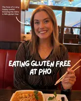 A social media post featuring a woman smiling at a table in a restaurant, highlighting the gluten-free menu options at Pho.