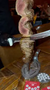 A promotional montage for a Brazilian steakhouse, featuring close-up shots of various meats being sliced from skewers, the salad bar, the interior, and dessert. The video includes persistent text overlays detailing the pricing for lunch and dinner services.