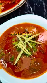 A short, punchy reel showcasing various dishes from Nehari House, including their signature Nihari, Lahori Chanay, and Indo-Chinese options like Chicken Manchurian and fried rice. The video focuses heavily on close-up, appetising shots of the food being served and prepared, ending with a shot of the restaurant storefront.