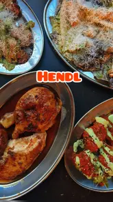 Here are a few options for your SEO alt text, keeping under the 125-character limit:

**Option 1 (Descriptive):**
Rotisserie chicken, buffalo wings, and sides served at Hendl inside Hackney Church Brew Co.

**Option 2 (Action-oriented):**
A delicious feast of rotisserie chicken and crispy smashed potatoes at Hendl, Hackney.

**Option 3 (SEO-focused):**
Rotisserie chicken dinner with buffalo wings and sides at Hendl at Hackney Church Brew Co.