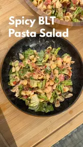 Here are a few options for your SEO alt text, keeping under the 125-character limit:

**Option 1 (Descriptive):**
Spicy chicken BLT pasta salad with crispy bacon, sundried tomatoes, and fresh lettuce in a white bowl.

**Option 2 (Action-oriented):**
A homemade spicy chicken BLT pasta salad recipe with crispy bacon, lettuce, and tomatoes.

**Option 3 (Keyword-focused):**
Bowl of spicy chicken BLT pasta salad made with smoked bacon, sundried tomatoes, and perinaise dressing.

**SEO Tip:** Option 1 is likely your best bet as it describes the visual elements clearly, which helps with both Google Image search and accessibility.