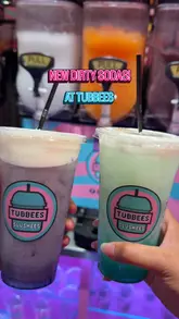 A short, energetic video showcasing the 'Dirty Soda' experience at Tubbees, featuring the slushie machines, menu options, and the final colorful drinks.