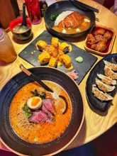 Here are a few options for your SEO alt text, keeping it under 125 characters:

**Option 1 (Descriptive):**
Steak tataki ramen, katsu curry, and spicy teriyaki chicken served at Maki & Ramen restaurant in Metrocentre.

**Option 2 (Focus on food):**
Close up of a delicious ramen bowl, katsu curry, and side dishes at Maki & Ramen in the Metrocentre.

**Option 3 (Brand focused):**
Table spread featuring steak tataki ramen and Japanese dishes at Maki & Ramen restaurant.

**SEO Tip:** Always include the restaurant name and location (if applicable) as these are high-intent search terms!