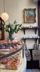 Here are a few options for your SEO alt text, keeping under the 125-character limit:

**Option 1 (Descriptive & SEO-focused):**
Aesthetic spread of gourmet pastries including a tiramisu croissant and danish at Fred Bakery in London Oxford Circus.

**Option 2 (Action-oriented):**
Freshly baked pastries and coffee displayed at the cosy, aesthetic Fred Bakery near Oxford Circus, London.

**Option 3 (Concise & keyword-rich):**
Assorted sweet and savoury pastries at Fred Bakery, a must-visit aesthetic cafe in Central London.

**Tip:** Search engines prefer descriptive text that helps a visually impaired user understand what is in the photo, while including the location (London/Oxford Circus) helps with local search rankings.