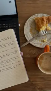 Here are a few options for your SEO alt text, depending on the focus of the image:

**Option 1 (Descriptive & SEO-focused):**
"A young woman working on her laptop in a cozy home office setup to finish a university essay on a Friday morning."

**Option 2 (Lifestyle/Vlog-focused):**
"Lifestyle influencer smiling while working on a laptop at home, preparing for a productive Friday study session."

**Option 3 (Short & punchy):**
"A student working on a university essay on a laptop as part of a Friday morning vlog."

**SEO Tip:** I included keywords like "student," "university essay," "laptop," and "Friday" to help search engines understand the context of your post.