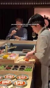 A high-quality, intimate look at a 12-course omakase dining experience in London. The video features close-up shots of chefs preparing delicate dishes like caviar-topped nigiri, sashimi, and wagyu, alongside sake pairings and views of the city skyline.