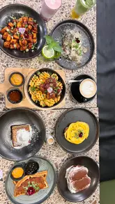 A fast-paced, energetic reel showcasing a variety of dishes and drinks at Milk & Egg, including waffles, scrambled eggs, truffle mushroom toast, Hong Kong French toast, Tiramisu, and specialty matcha/cloud drinks.