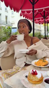 A short vlog-style reel featuring a creator enjoying brunch at an outdoor terrace in London. The video highlights the relaxed atmosphere, tea, scrambled eggs, and pancakes, emphasizing the appeal of outdoor dining in the city.