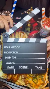 Here are a few SEO-friendly alt text options, depending on the focus:

**Option 1 (Descriptive & SEO-focused):**
"A spread of Halal burgers, BBQ wings, loaded fries, and milkshakes at Hollywood Burgers & Shakes in Stretford, Manchester."

**Option 2 (Action-oriented):**
"Close-up of a table filled with gourmet burgers, chicken wings, loaded fries, and colourful milkshakes at a restaurant."

**Option 3 (Brand-focused):**
"The Top Gun burger, peri wings, and loaded fries served at Hollywood Burgers & Shakes, Stretford."

**Tip:** Choose the one that best describes the main subject of your specific photo. If the photo highlights the milkshakes, go with Option 1; if it’s a wide shot of the whole meal, Option 2 is best.