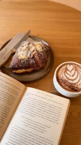 A short, aesthetic video showcasing a visit to Zennor Coffee in Glasgow. The video highlights the minimalist interior, the coffee menu, and the experience of enjoying a latte and an almond croissant in a quiet, relaxing setting.