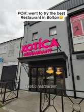 Here are a few options for your alt text, keeping it under 125 characters:

**Option 1 (Descriptive):**
Platter of delicious Halal food served at Xotica Restaurant in Walkden, Bolton.

**Option 2 (Search-focused):**
A variety of tasty dishes at Xotica Restaurant, a popular Halal dining spot in Walkden, Bolton.

**Option 3 (Concise):**
Gourmet Halal meal served at Xotica Restaurant in Walkden, Bolton.

**SEO Tip:** Alt text is primarily for accessibility, so it is best to describe exactly what is in the photo (e.g., "A juicy burger and fries" or "A table spread of curries") rather than just the restaurant name!