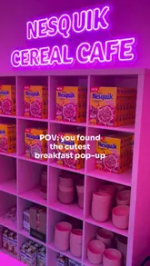 A short, bright promotional video showcasing a Nesquik strawberry cereal pop-up in Covent Garden. The video features the neon-lit interior, the menu options, and the cereal bowls, highlighting the family-friendly nature of the event.