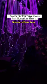 A couple visits the Avora immersive experience in London, showcasing the bioluminescent set design, interactive actors, and glowing cocktails.