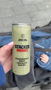 Here are a few options for your alt text (all under 125 characters):

*   **Option 1 (Descriptive):** Cans of Stacked matcha drinks displayed on a shelf at The Alcohol Company store on Boucher Road in Belfast.
*   **Option 2 (Action-oriented):** A selection of Stacked matcha drink cans available to purchase at The Alcohol Company in Belfast.
*   **Option 3 (Concise):** Stacked brand matcha drinks stocked on a shelf at The Alcohol Company on Boucher Road, Belfast.

**SEO Tip:** Always include the location (Belfast/Boucher Road) and the brand name (Stacked) as these are the keywords people are most likely to search for.