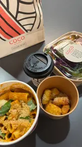 A short, fast-paced video documenting a visit to a Coco di Mama location, highlighting the ordering process via a kiosk and showcasing the food and coffee items purchased.
