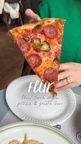 A short, energetic reel showcasing Flùr, a New York-style pizza and pasta bar located within Bonnie & Wild market in Edinburgh. The video features close-up shots of pizza slices, pasta dishes, and the kitchen preparation area, along with the ordering process.
