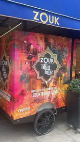 A review of the Sunday Roast experience at Zouk Tea Bar & Grill in Manchester, featuring a variety of dishes including samosa chaat, spiced halloumi pakora, a roast platter with chicken, beef, and lamb, and desserts like chai masala brulee and pistachio souffle.