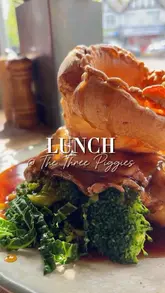 A montage of various dishes and cocktails served at The Three Piggies, including a Sunday roast, burger, and desserts, set to music with text overlays identifying the items.