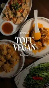 A review of Tofu Vegan in Brighton, highlighting its plant-based Chinese menu. The video features the creator trying various dishes, including dumplings, oyster mushrooms, and mock fish, while also showing the restaurant's interior and dog-friendly policy.