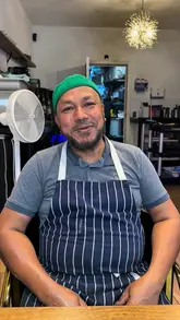 The creator visits Mishtidesh in Lozells, Birmingham, for a casual meal. The video features a walkthrough of the menu, a brief interaction with the chef, and a taste test of the chef's special chicken butterfly dish and rohu fish with desi uri.
