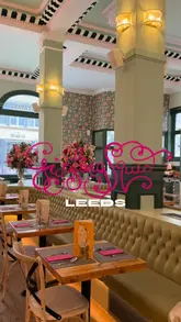 Here are a few options for your SEO alt text, keeping it under 125 characters:

**Option 1 (Descriptive):**
Delicious Thai tapas set lunch served at Giggling Squid restaurant on Park Row in Leeds.

**Option 2 (Focus on keywords):**
A variety of Thai tapas dishes served at Giggling Squid restaurant in Leeds city centre.

**Option 3 (Short & punchy):**
Thai food feast at Giggling Squid restaurant in Leeds featuring their popular lunch tapas sets.