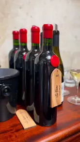 Here are a few options for your SEO alt text, all under 125 characters:

**Option 1 (Focus on the event):**
Glasses of Plaimont red wine served with fine dining at Hawksmoor Edinburgh for an exclusive wine tasting event.

**Option 2 (Focus on the brand/product):**
Le Faîte Rouge and Tannat Tardif wines from Plaimont paired with gourmet food during a dinner at Hawksmoor Edinburgh.

**Option 3 (Concise):**
Plaimont winery red wines being enjoyed with a luxury meal during an evening event at Hawksmoor Edinburgh.

**SEO Tip:** I recommend **Option 1** as it includes the brand name, the location, and describes exactly what is happening in the photo for screen readers.