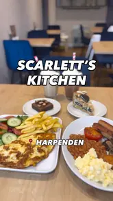 A tour of Scarlett's Kitchen in Harpenden, showcasing the cafe's interior, decor, kids' play area, and a selection of breakfast items, desserts, and iced drinks.
