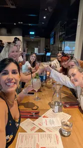 A group of content creators spends a day in Glasgow visiting a pottery painting studio, followed by a meal at a restaurant and drinks at a bar with live music.