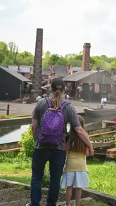 This reel provides a comprehensive tour of the Black Country Living Museum, highlighting its immersive historical setting, vintage transport, and various attractions like shops, a schoolhouse, and a fairground. It effectively uses a nostalgic tone and upbeat music to showcase the experience, while also including practical information about the annual pass.