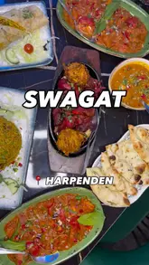 Here are a few options for your SEO alt text (all under 125 characters):

**Option 1 (Descriptive & SEO-focused):**
A delicious spread of Indian dishes including curry, naan, and momos at Swagat restaurant in Harpenden.

**Option 2 (Focus on the meal):**
Table full of Indian food featuring Rajasthan chicken, lamb biryani, and garlic naan at Swagat, Harpenden.

**Option 3 (Short & Punchy):**
A colorful feast of Indian cuisine including Nepali momos and mixed grill at Swagat restaurant, Harpenden.

**SEO Tip:** I recommend **Option 1** as it includes the restaurant name, location, and the primary dish type, which are the most important keywords for search engines.