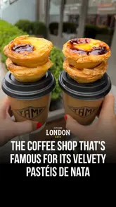 Here are a few options for your SEO alt text, keeping under the 125-character limit:

**Option 1 (Descriptive):**
Freshly baked Pastel De Nata and speciality iced coffee served at Tamp Coffee on Devonshire Road in Chiswick, London.

**Option 2 (Action-oriented):**
A tray of gooey, golden Pastel De Nata pastries and a coffee at Tamp Coffee shop in Chiswick, West London.

**Option 3 (Concise):**
Speciality coffee and delicious, fluffy Pastel De Nata pastries at Tamp Coffee, a must-visit cafe in Chiswick, London.