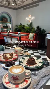 Here are a few options for your alt text, depending on the specific focus:

**Option 1 (Descriptive & SEO-focused):**
"Gourmet date cake and luxury coffee served at Qinwan London cafe inside The Chancery Rosewood."

**Option 2 (Action-oriented):**
"Elegant cafe interior at Qinwan London, featuring signature date desserts at The Chancery Rosewood."

**Option 3 (Concise):**
"Luxury Qinwan cafe in London serving signature date cakes at The Chancery Rosewood."

**Tips for SEO:**
*   Include the location (**London**) and the venue name (**The Chancery Rosewood**) as these are high-intent search terms.
*   Include the main product (**date cake**) as that is the unique selling point of the brand.
*   Keep it under 125 characters to ensure compatibility with screen readers.