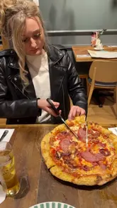 A vlog-style review of an ASK Italian restaurant in Brighton, featuring the creator introducing the venue, scanning the menu, and showcasing a variety of starters, mains, and desserts, culminating in a birthday celebration.