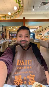A straightforward venue tour of Daiu, highlighting the all-you-can-eat Korean BBQ and hotpot experience. The video pans across the buffet selection, including sushi, raw meats, and sides, before showing the cooking process at the table and the ice cream station.