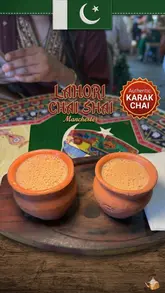 A short review video featuring a visit to Lahori Chai Shai in Manchester, highlighting their authentic Karak Chai served in traditional clay cups. The creator showcases the vibrant, culturally-inspired interior decor and the exterior of the venue before enjoying the tea.