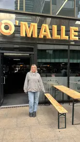 A short, energetic reel featuring two creators visiting O'Malley's in Manchester, highlighting the Guinness, whiskey, and a spice bag with curry sauce.