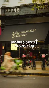 A cinematic tour of a pop-up ramen restaurant located inside a grocery store, highlighting the communal dining experience, open kitchen, and appetizing ramen dishes.