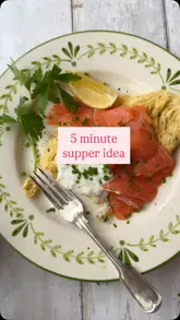 A short, instructional video demonstrating how to prepare a simple chive omelette topped with smoked salmon, sour cream, and a squeeze of lemon, presented as a quick supper idea.