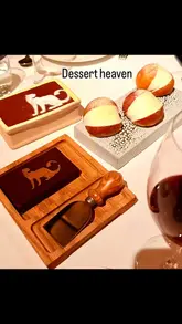 A montage video showcasing the interior, menu, and various dishes at an Italian restaurant in Mayfair, including pizza, burrata, fish, chicken, and desserts.