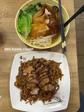 🤩BEST CANTONESE ROAST MEATS IN CARDIFF🇭🇰🍽️

📍BBQ XIANG, Cardiff (Caroline Street aka Chippy lane) 

🍜CANTONESE TWO ROAST MEATS (SOY CHICKEN & ROAST DUCK) RAMEN SOUP NOODLES - served in your choice of broth, my auntie went for bone broth. This noodle soup is both authentic and comforting! Plus the portion size is HUGE for £14.50🤩

🍜FRIED UDON NOODLES WITH CHAR SIU (ROAST PORK) - tender char siu in great “wok hei” udon noodles, giving it that distinctive umami flavour! 

If you haven’t visited, what are you waiting for🤗

#cardiff #cantonesefood #roastmeat #foodie #fyp