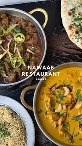 Here are a few options for your alt text, keeping it under 125 characters and SEO-focused:

**Option 1 (Descriptive & SEO-focused):**
"A table full of delicious South Asian dishes at Nawaab restaurant in Leeds."

**Option 2 (Action-oriented):**
"Close up of colorful, authentic Indian curry dishes served at Nawaab restaurant in Leeds city centre."

**Option 3 (Brief & Punchy):**
"Award-winning South Asian cuisine served at Nawaab, a popular restaurant in Leeds."

**SEO Tip:** Including the restaurant name ("Nawaab") and the location ("Leeds") is the most important part for your search ranking!