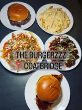 Here are a few SEO-friendly alt text options for your image:

**Option 1 (Focus on the food/dish):**
Delicious Korean BBQ Seoul burger and loaded fries from The Burgerzzz restaurant in Coatbridge.

**Option 2 (Focus on the brand/location):**
A mouthwatering burger and loaded fries meal at The Burgerzzz restaurant in Coatbridge town centre.

**Option 3 (Detailed/Descriptive):**
Gourmet Korean BBQ burger with saucy wings and cheese loaded fries at The Burgerzzz restaurant in Coatbridge.

**Recommendation:** If you have to choose one, **Option 2** is the best for SEO as it includes the restaurant name, the location, and the product.