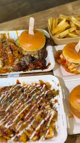 A vlog-style reel featuring a visit to The Northern Market in Leeds, highlighting the food from Big Buns, including burgers, loaded fries, and wings.